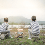 child-asian-with-teddy-bear-sitting-site-reservoir-is-background-1.png